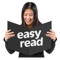 A picture of a person reading a document which has the EasyRead logo on it.