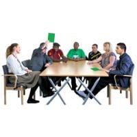 A group of people are sitting round a table having a meeting.