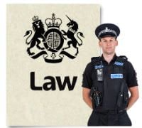 A picture of a police man standing in front of a document that says law=